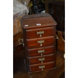 A MINIATURE MAHOGANY CHEST OF FIVE DRAWERS with twin brass handles (alterations)