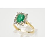 AN EMERALD AND DIAMOND RING, designed with a central rectangular cut emerald and round brilliant cut