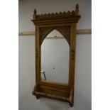 A LATE 20TH CENTURY PINE RECTANGULAR GOTHIC STYLE BATHROOM WALL MIRROR with towel rail
