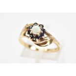 A 9CT GOLD OPAL AND SAPPHIRE CLUSTER RING, designed as a central circular opal cabochon within a