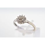 A 9CT WHITE GOLD DIAMOND CLUSTER RING, designed as a tiered single cut, claw set diamond cluster,