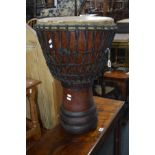 AN AFRICAN BONGO DRUM, diameter 41cm x height 65cm