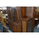 A MODERN MAHOGANY FOUR DOOR BOOKCASE with glazed door to top section, width 152cm x height 193cm x