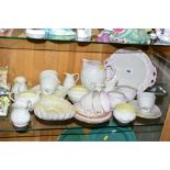 A COLLECTION OF BELLEEK PORCELAIN TEAWARES, JUGS ETC, to include shell and coral design teacups/