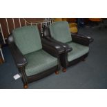 A PAIR OF EARLY TO MID 20TH CENTURY ART DECO GREEN LEATHERETTE ARMCHAIRS with removable cushions (