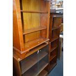 A MID CENTURY BOOKCASE with two sliding glass doors over two laminated wood doors, width 92cm x