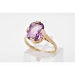 A PURPLE PASTE RING, designed with a cushion shape purple paste in a four claw setting to the