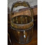 A 19TH CENTURY OAK AND WROUGHT IRON COOPERED WATER BUCKET