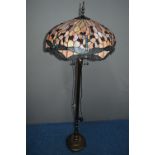 A TIFFANY STYLE STANDARD LAMP, with triple light fittings on a brassed base, diameter 53cm x