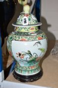 A CHINESE FAMILLE VERT JAR AND COVER, hand painted with floral and insect panels, Chrysanthemum