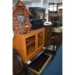 A MODERN TV CABINET, cheval mirror, glass topped coffee table, oak bedside cupboard and a modern