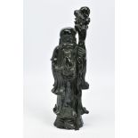 A CARVED NEPHRITE JADE FIGURE, depicting a robed bearded figure holding a staff and a pomelo,