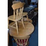 A MODERN CIRCULAR PINE PEDESTAL TABLE, diameter 104cm and four beechwood chairs (5)