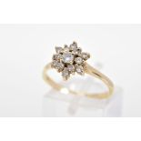 A DIAMOND CLUSTER RING, the tiered cluster set with thirteen round brilliant cut diamonds, to the