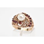 A GEM RING, designed as a tapered band with textured pierced and scrolling decoration to the central