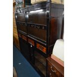 A LATE 19TH/EARLY 20TH CENTURY JAPANNED TWO TIER DOUBLE SLIDING DOOR CUPBOARD, black ground with