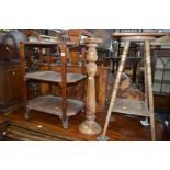 AN EARLY 20TH CENTURY OAK AND MAHOGANY THREE TIER TEA TROLLEY, together with a plant stand and a