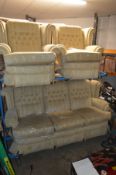 AN OATMEAL BUTTONED WINGBACK THREE PIECE LOUNGE SUITE, comprising of a three seater settee and a