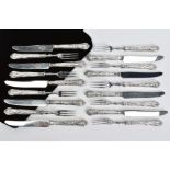 NINE PAIRS OF DESSERT KNIVES AND FORKS, with embossed decoration to the silver handles, with