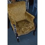 A LATE 19TH CENTURY FOLIATE MAHOGANY GOLD UPHOLSTERED ARMCHAIR