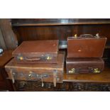 A VINTAGE BROWN LEATHER SUITCASE, a gent's briefcase and two other suitcases (sd) (4)