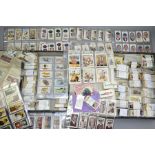 A LARGE COLLECTION OF CARRERAS AND CHURCHMAN CIGARETTE CARDS in two lock spring boxes and consisting