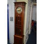 AN EARLY TO MID 20TH CENTURY WALNUT LONGCASE CLOCK, with single door to the movement and trunk,
