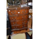 A REPRODUCTION MAHOGANY SERPENTINE CHEST OF FOUR DRAWERS on bracket feet, width 51cm x depth 35cm