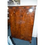 A REPRODUCTION MAHOGANY TWO PIECE BEDROOM SUITE, comprising a double door wardrobe and a dressing
