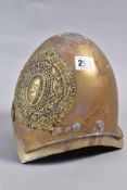 A HEAVY BRASS/ALLOY EXAMPLE OF MILITARY HELMET, with large Royal Cypher wreath and crown to
