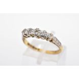 AN 18CT GOLD FIVE STONE DIAMOND RING, designed as a central brilliant cut diamond and outer single