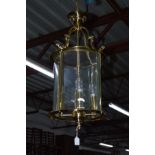 A LATE 20TH CENTURY BRASSED CYLINDRICAL HANGING CEILING LIGHT, diameter 30cm x height 60cm