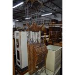 A MODERN WICKER AND IRON HALL STAND with magazine shelf, three drawers and a basket shelf, width