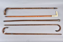 A QUANTITY OF WALKING STICKS, to include a silver topped stick, maker 'B.S.D. Cocke Victory