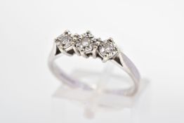 A 9CT WHITE GOLD THREE STONE DIAMOND RING, designed as three brilliant cut diamonds within