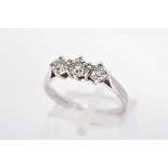 A 9CT WHITE GOLD THREE STONE DIAMOND RING, designed as three brilliant cut diamonds within