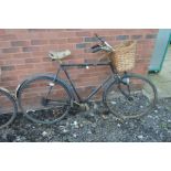 A VINTAGE UNSIGNED BLACK GROUND GENTLEMANS BICYCLE with a Sturmey Archer gear mechanism (sd)