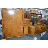 AN EARLY TO MID 20TH CENTURY ART DECO WALNUT FOUR PIECE BEDROOM SUITE, comprising a triple door