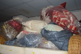 FIVE BAGS OF SOFT FURNISHINGS, to include cushions and throws (4)