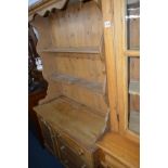 A VICTORIAN PINE DRESSER with a two tier plate rack above three drawers, width 105cm x depth 45cm