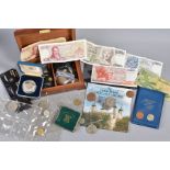 A SHOE BOX CONTAINING COINS AND COMMEMORATIVES with a small amount of Greek banknotes, etc