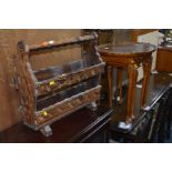 A BURR WALNUT NEST OF THREE TABLES with a pie crust edge and a rustic magazine rack (2)