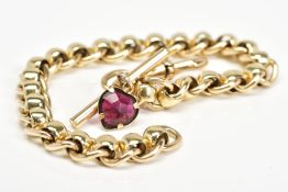 A MODERN 9CT GOLD ROLLER BALL LINK BRACELET FITTED TO A T BAR, garnet heart drop and swivel clasp,