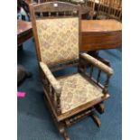 AN OAK AMERICAN ROCKING CHAIR together with a pine wall hanging plate rack (2) (situated by lot