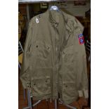 AN EXAMPLE OF AN M43 US PARATROOPERS JACKET FOR WWII, this has the QM label inside indicating the