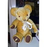 A LARGE MERRYTHOUGHT GOLDEN PLUSH TEDDY BEAR, c.1970's, vertical stitched nose, plastic eyes,