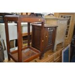 AN EDWARDIAN WALNUT FALL FRONT PURDONIUM together with a light oak pot cupboard and an occasional