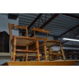 A MID TO LATE 20TH CENTURY WALNUT FOLD OVER CARD TABLE and two satinwood chairs (3)