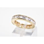 A 14CT GOLD CUBIC ZIRCONIA ETERNITY RING, designed as channel set circular and rectangular