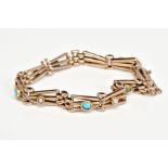 AN EARLY 20TH CENTURY 9CT GOLD GATE BRACELET, each panel set with turquoise or split pearls, to